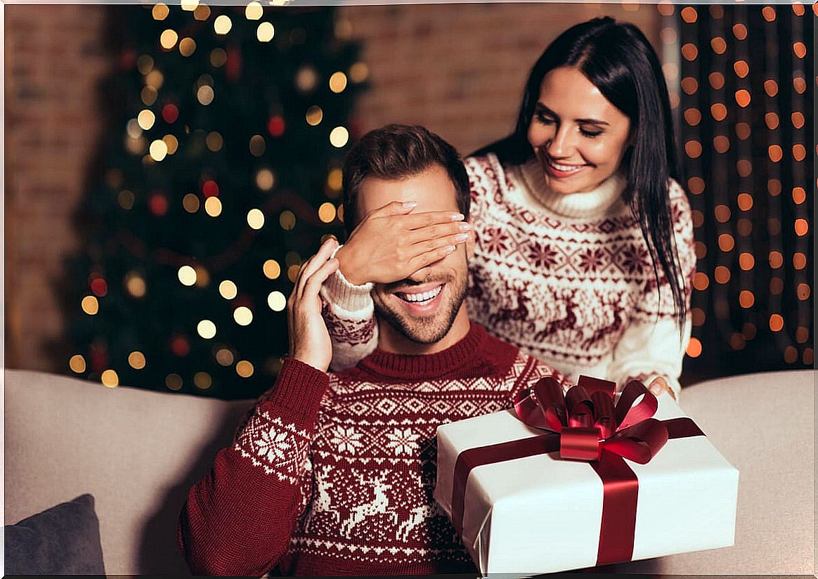 Woman giving a gift to her partner