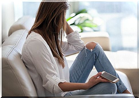 Woman on sofa thinking about the past