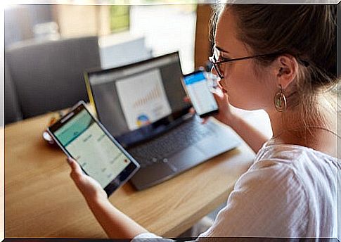 Woman with various electronic devices