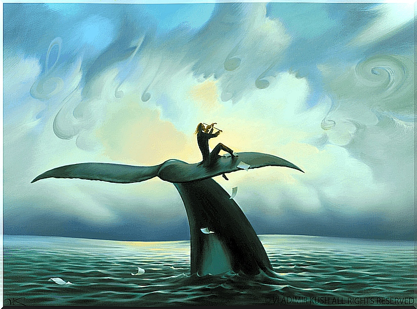 Man playing the violin on top of a whale's tail