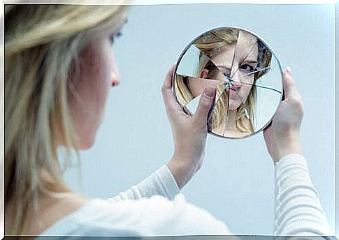 Woman looking at herself in a mirror