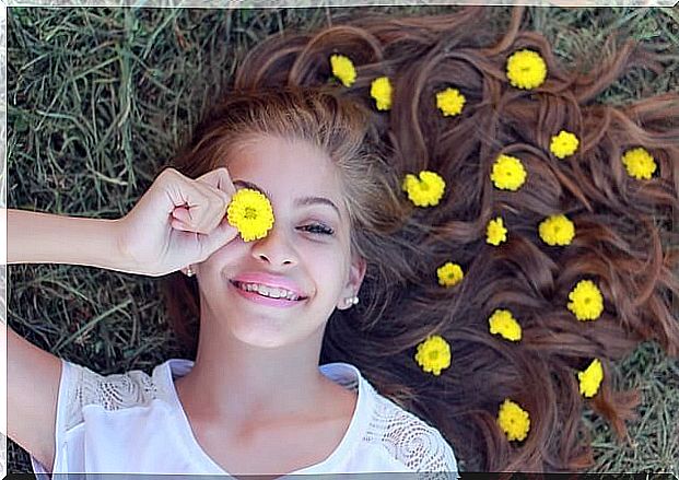 Teen girl with yellow flowers representing how to negotiate with your teenage son