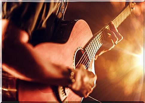 Young boy playing a guitar