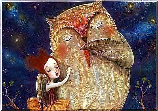 Girl with closed eyes hugging an owl