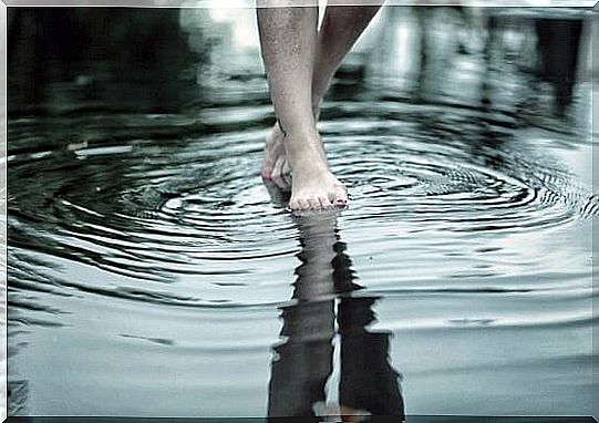 feet walking in a river