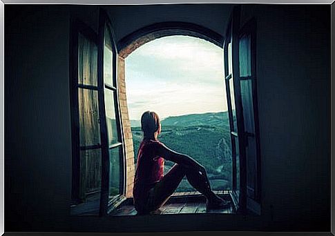 Woman thinking by the window