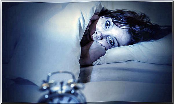 Woman wakes up with anxiety from sleep paralysis