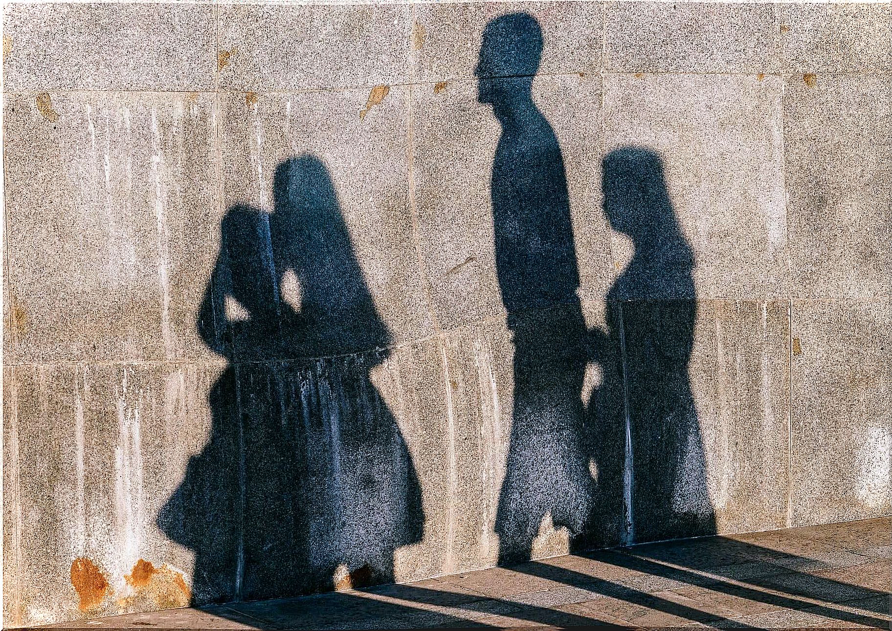 Wall with shadows of people