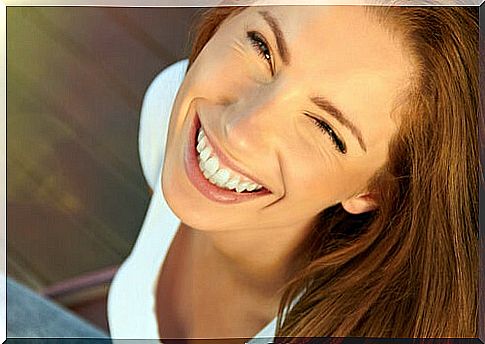 Woman with a big smile representing happy people