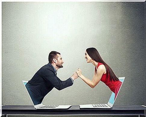 Couple coming out of a computer representing cybernetic relationships