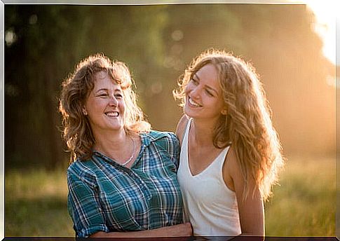 Mother and daughter smiling