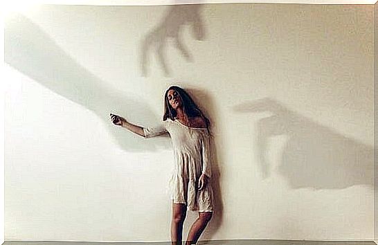 woman with shadows that point to her guilt