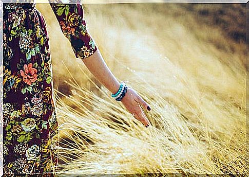 Woman walking through the field finding strength to keep going