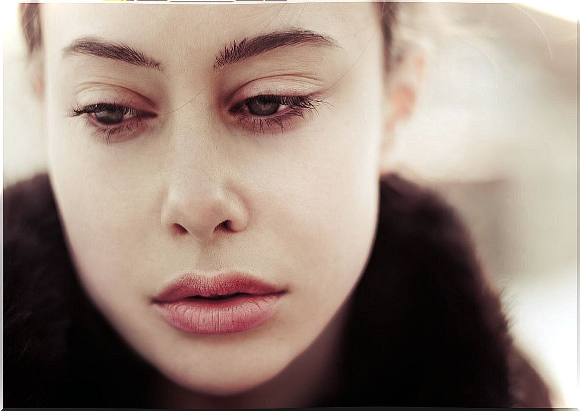 Woman thinking Why does sadness last longer than other emotions?